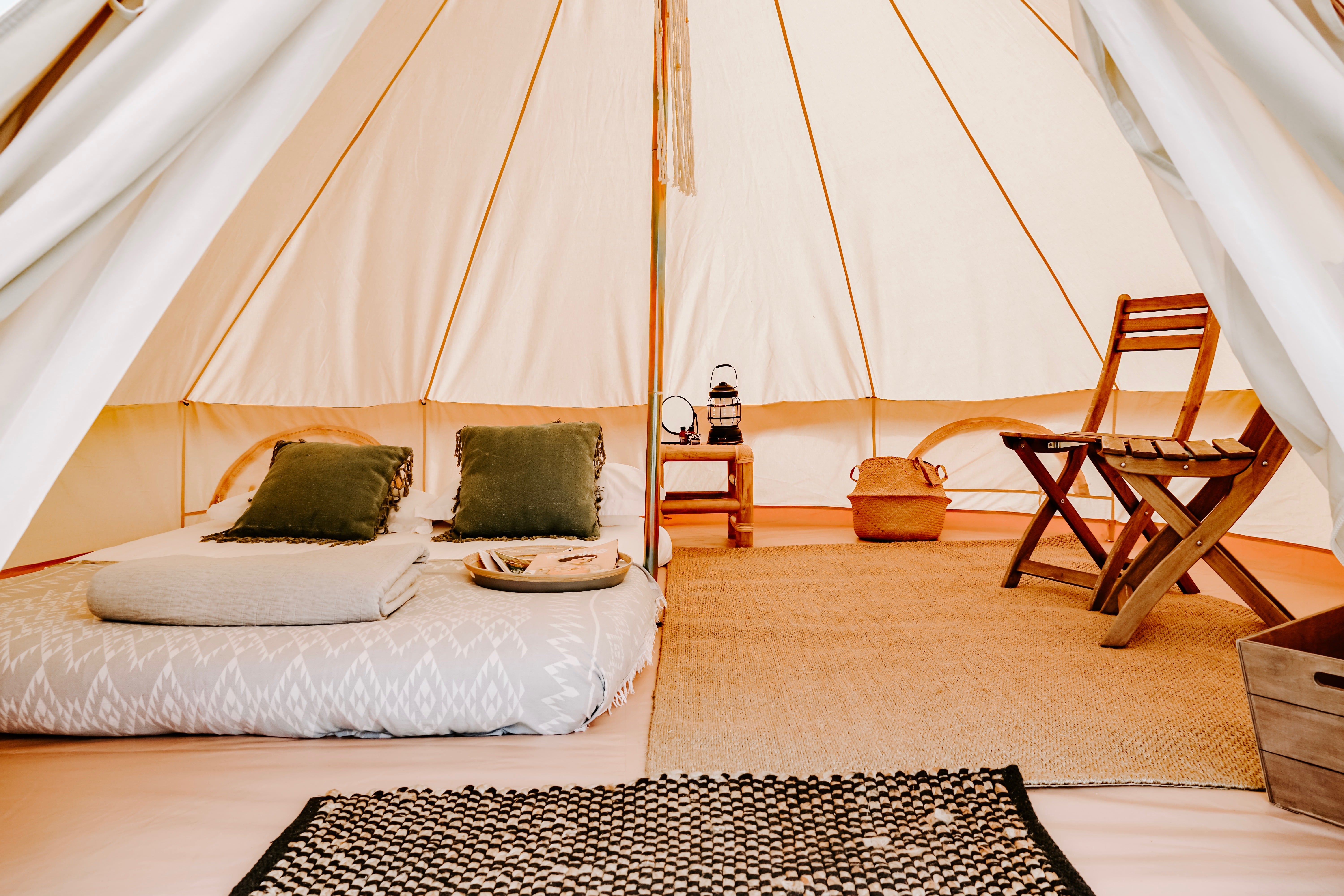 4m bell tent inside with queen bed