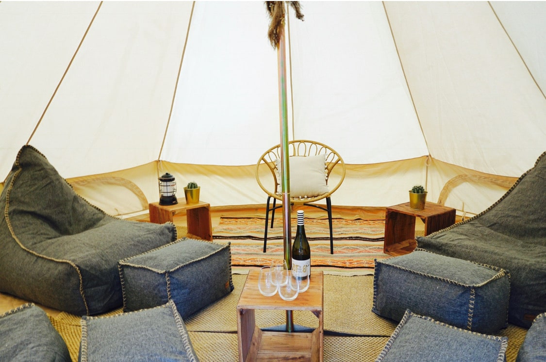 inside lounge bell tent featuring bean bags