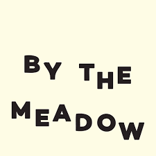 Image showing By the meadow festival logo as they have been a client of Twilight Glamping